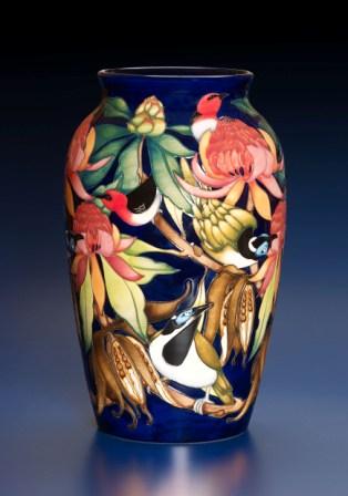 Australian Moorcroft Collection available only in with an exclusive Australian Map back-stamp on each piece made until 31st December, 2007. Numbered edition The Black Cockatoo, Kulan, Calgaroo, Black Bean, Banksia. The main designer of this collection Philip Gibson.  For 2008 there are 2 new additions to the collection - 1 a 576/9 with the Australian Koala nestled in the branches of a flowering gum tree and the other a 402/4 Uluru encircled by a goanna and the sides covered in the native desert pea flower.